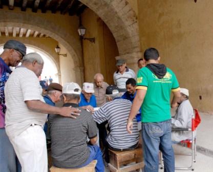 Radio Bemba often plays at domino games.  Old Havana photo by Caridad.