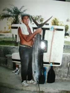 Pescador con la presa.